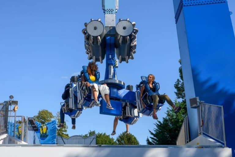 Riders on Booster Unhinged ride entertainment