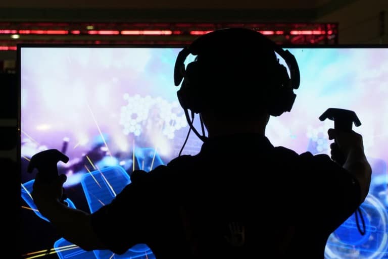Person wearing VR headset playing game