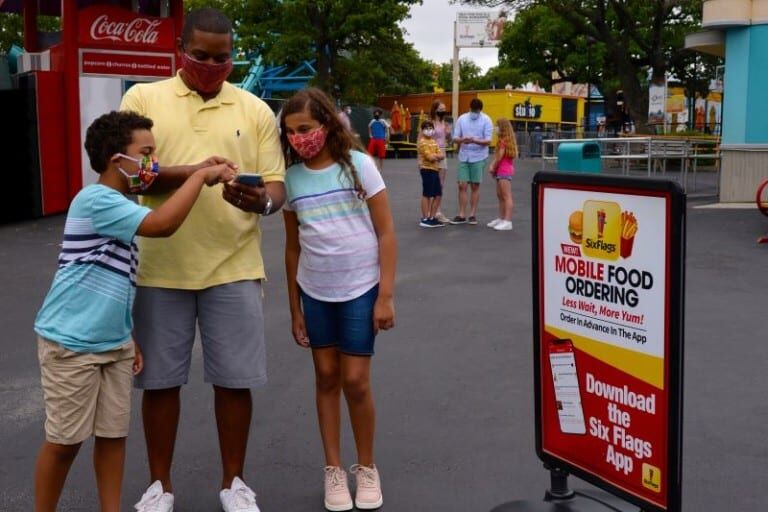 Guests using the Six Flags mobile ordering app theme parks coronavirus