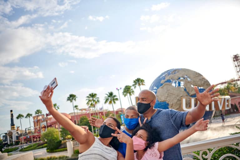 theme parks coronavirus family at Universal Orlando in masks