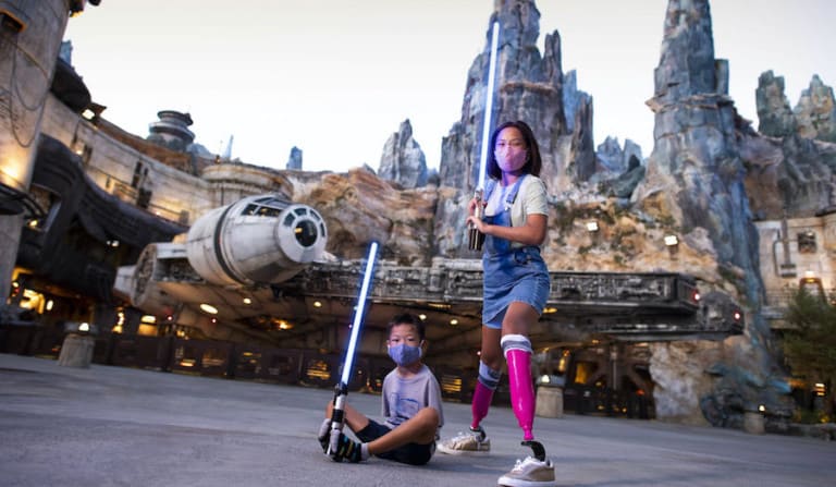 kids-at-Galaxys-Edge-with-lightsabers storytelling after covid