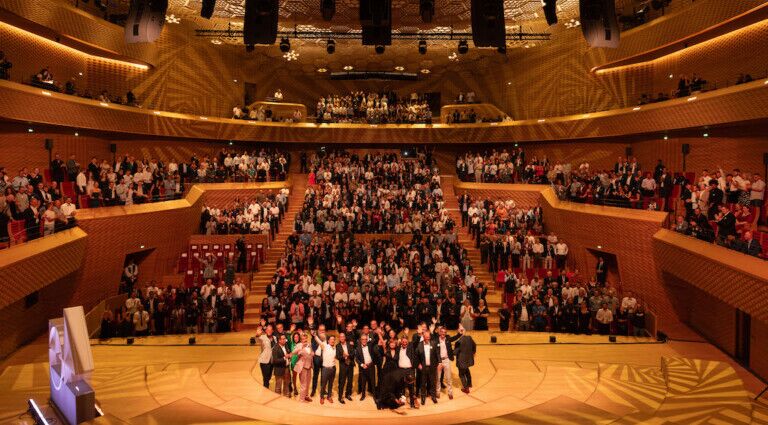 The entire L-Acoustics team celebrating the company’s 40th anniversary at Paris’ La Seine Musicale