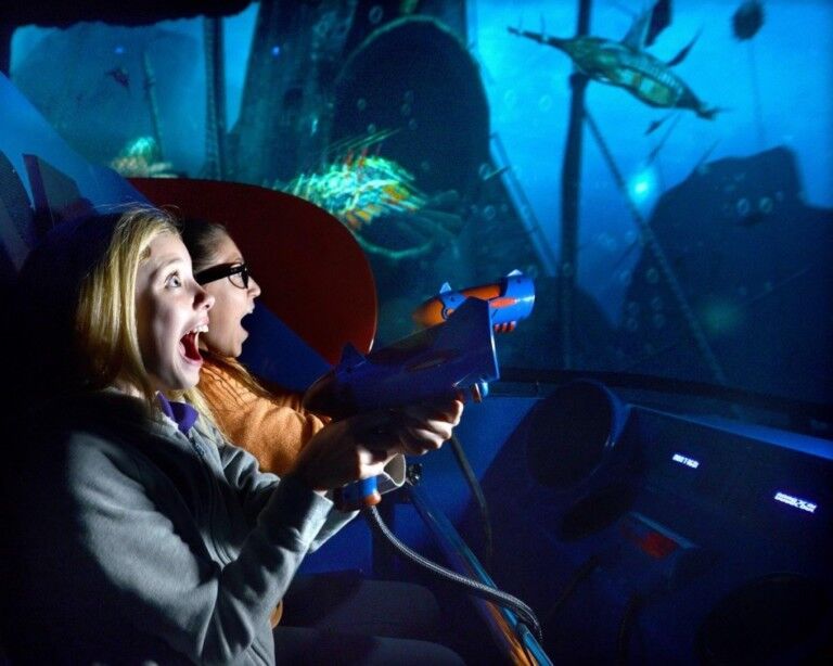 children-shooting-guns-in-a-dark-ride-by-triotech