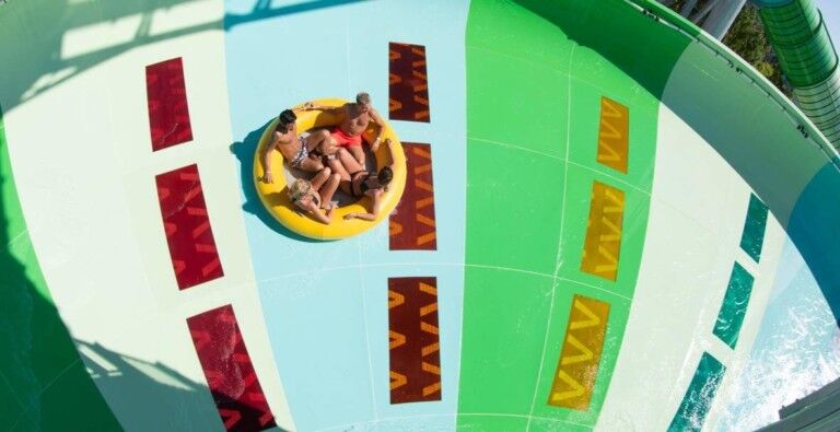 Guests on raft Polin Storm Racer waterslide at aqualand frejus