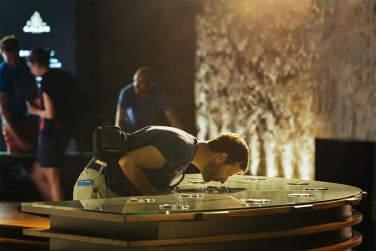 man looking inside glass case at Calem Cellars Port Experience